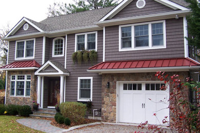 Inspiration for a large timeless brown two-story wood exterior home remodel in Other with a shingle roof