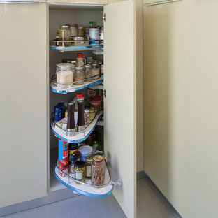 Inspiration för moderna kök, med en undermonterad diskho, släta luckor, gröna skåp och rostfria vitvaror