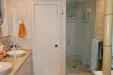 Alcove shower - mid-sized transitional master porcelain tile and beige floor alcove shower idea in Other with flat-panel cabinets, beige cabinets, beige walls, a vessel sink, quartzite countertops, a hinged shower door and beige countertops
