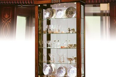 Display curio cabinet with mirrored back, dark walnut.