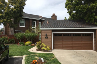 Mid-sized elegant brown two-story wood exterior home photo in San Francisco with a shingle roof