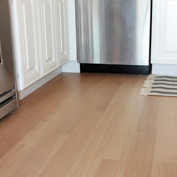 Refinish existing floors matching new floor installed.