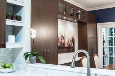 Enclosed kitchen - small contemporary u-shaped linoleum floor enclosed kitchen idea in Ottawa with a drop-in sink, flat-panel cabinets, dark wood cabinets, quartz countertops, yellow backsplash, stone tile backsplash and stainless steel appliances