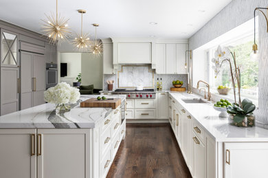 Large transitional galley dark wood floor and brown floor eat-in kitchen photo in Detroit with an undermount sink, recessed-panel cabinets, white cabinets, quartz countertops, white backsplash, stone tile backsplash, stainless steel appliances, an island and white countertops