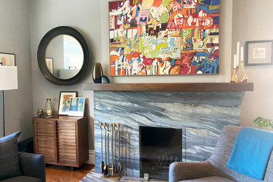 Family room - mid-sized modern open concept medium tone wood floor, brown floor and coffered ceiling family room idea in San Francisco with gray walls, a standard fireplace and a stone fireplace