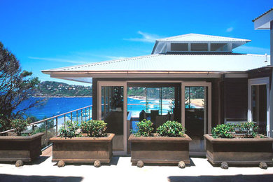 This is an example of a beach style home design in Sydney.
