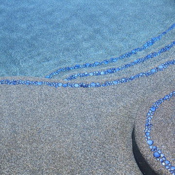 Beautiful Custom Freeform style salt water pool with raised spa