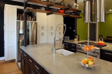 Example of a huge urban medium tone wood floor eat-in kitchen design in Richmond with a farmhouse sink, shaker cabinets, white cabinets, concrete countertops, blue backsplash, glass sheet backsplash, stainless steel appliances and two islands