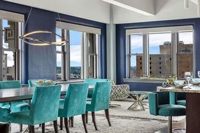 Example of a large trendy dark wood floor and brown floor great room design in St Louis with blue walls