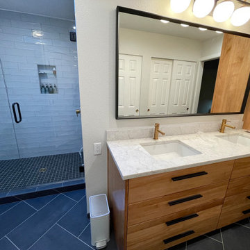 Chic Herring Bone Floor Revitalizes Outdated Bathroom