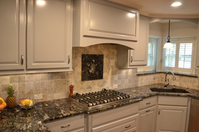 Photo of a transitional kitchen in Houston with granite benchtops, grey splashback and ceramic splashback.