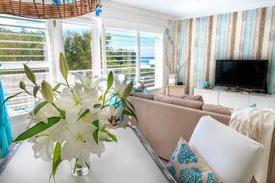 Inspiration for a beach style living room in Sydney.