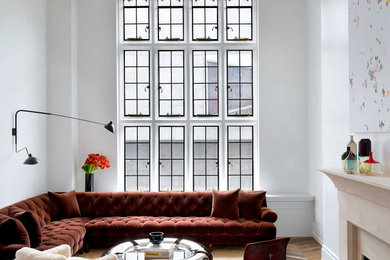 Example of a large trendy medium tone wood floor living room design in New York
