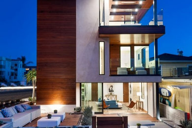 Large minimalist brown three-story mixed siding flat roof photo in Los Angeles