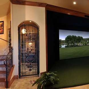 Large open plan home cinema in Phoenix with beige walls, limestone flooring, a projector screen and beige floors.