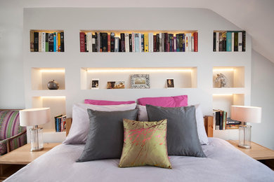This is an example of a contemporary bedroom in London with grey walls.