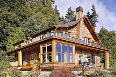 Beach style two-storey exterior in Seattle with a gable roof.