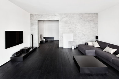 Photo of a modern family room in San Francisco with black floor.