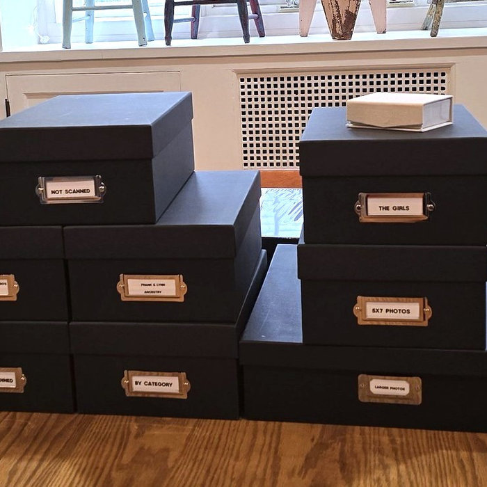 Photos organized in archival boxes by Simplify Buffalo Photo Organizing