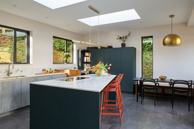Design ideas for a medium sized contemporary dining room in Kent with a feature wall.