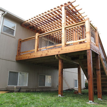 "Arch knotty" cedar deck with pergola