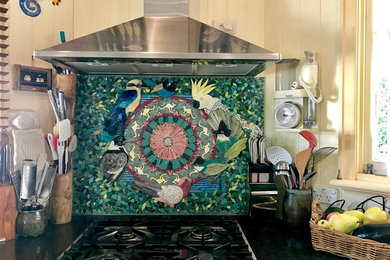 This is an example of an eclectic kitchen in Brisbane with ceramic splashback.