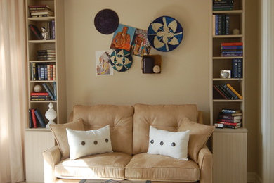 Mid-sized eclectic freestanding desk porcelain tile study room photo in Miami with beige walls