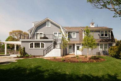 Beach style wood and shingle exterior home photo in Boston