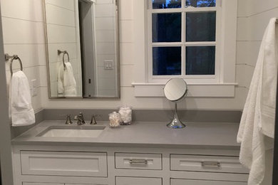 Mid-sized transitional 3/4 mosaic tile floor and white floor bathroom photo in Charleston with shaker cabinets, white cabinets, white walls, an undermount sink, quartzite countertops and gray countertops