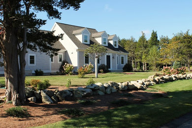 Example of a beach style home design design in Boston