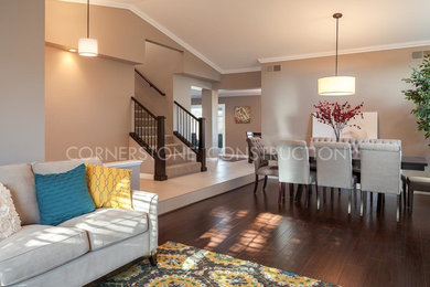 Inspiration for a large contemporary open concept medium tone wood floor living room remodel in Los Angeles with gray walls