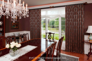 Large elegant medium tone wood floor and brown floor enclosed dining room photo in Other with brown walls