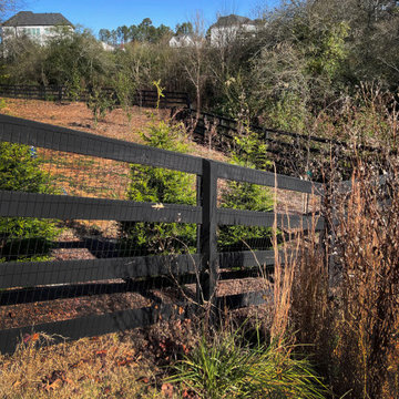 Black four rail gate with wire