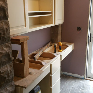 Residential cabinet installation pictures at different stages of completion