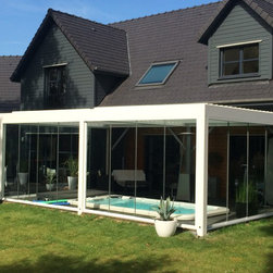 Modern terrace cover enclosed with glass panels for pool - Awnings