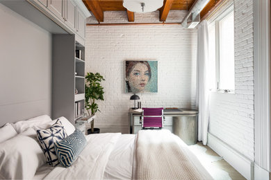 Example of an urban bedroom design in Chicago