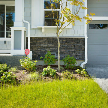 Stone contrasts with cedar siding