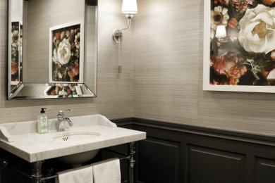Inspiration for a traditional powder room in San Francisco with beige walls, grey floor, white benchtops and a freestanding vanity.