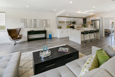 Living room - mid-sized modern formal and open concept laminate floor living room idea in San Francisco with white walls, no fireplace and no tv