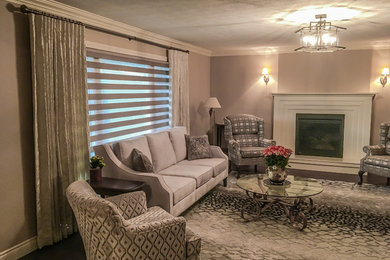 Inspiration for a mid-sized timeless dark wood floor and brown floor living room remodel in Other with a standard fireplace and a wood fireplace surround