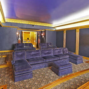 Eclectic enclosed home cinema in Dallas with blue walls, carpet and multi-coloured floors.