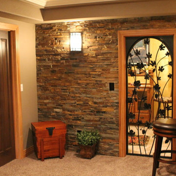 Eye-popping Denver Basement Remodel with hidden bookcase doors and tray ceilings