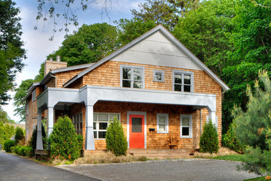 Inspiration for a large craftsman brown two-story wood gable roof remodel in New York