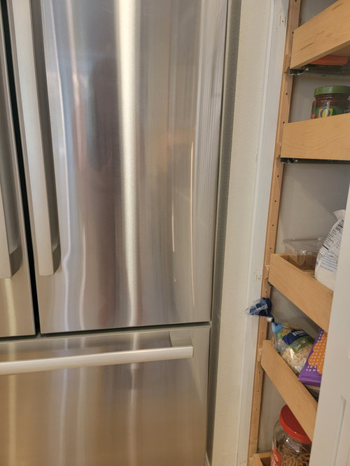 Fridge door hitting drywall corner