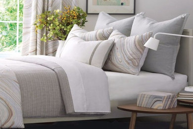 Example of a classic master carpeted and gray floor bedroom design in Sacramento with gray walls