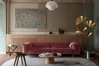 Family room - mid-sized 1960s medium tone wood floor and brown floor family room idea in Berlin with green walls, no fireplace and no tv
