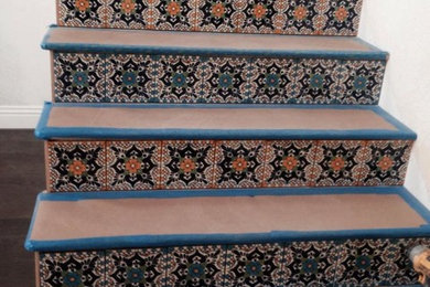 Mid-sized straight staircase photo in Orange County with tile risers