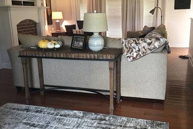 Inspiration for a mid-sized transitional open concept dark wood floor family room remodel in Chicago with white walls, a standard fireplace, a brick fireplace and a media wall