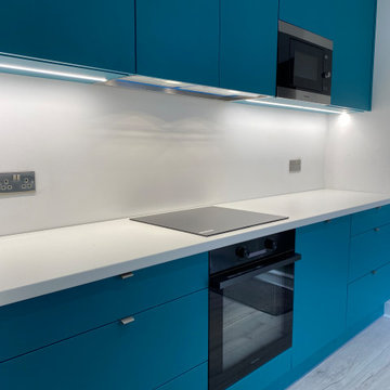 Teal & White Bespoke Kitchen with Feature Wall – London E6