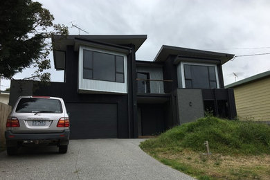 Photo of a beach style home design in Geelong.